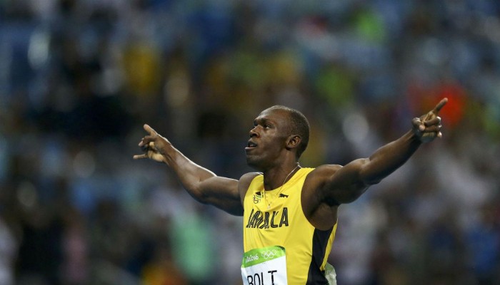 Bolt stays on track for historic treble-treble with 200m win